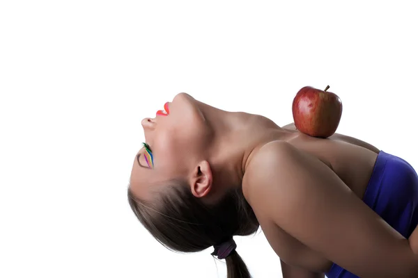 Portrait of flexible young girl posing with apple — Stock Photo, Image