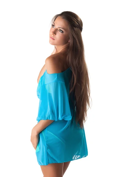Pretty young girl posing in blue sundress Stock Photo