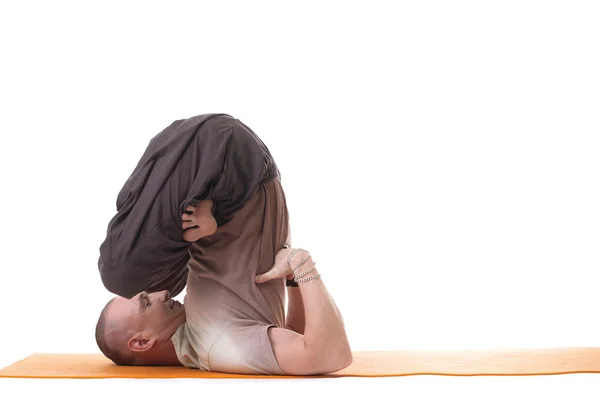 Yoga trainer posing in difficult asana — Stock Photo, Image