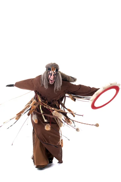 Shot of angry shaman dancing with tambourine — Stock Photo, Image