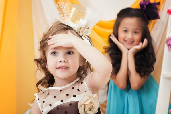 Portrait of cute girlfriends playing in studio — Stock Photo, Image