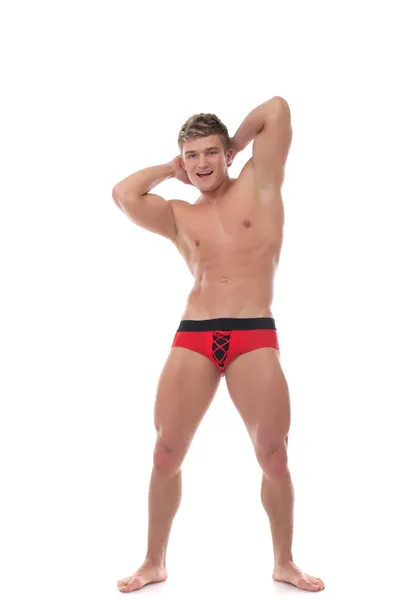 Fröhlicher muskulöser Kerl wirbt für Unterwäsche — Stockfoto