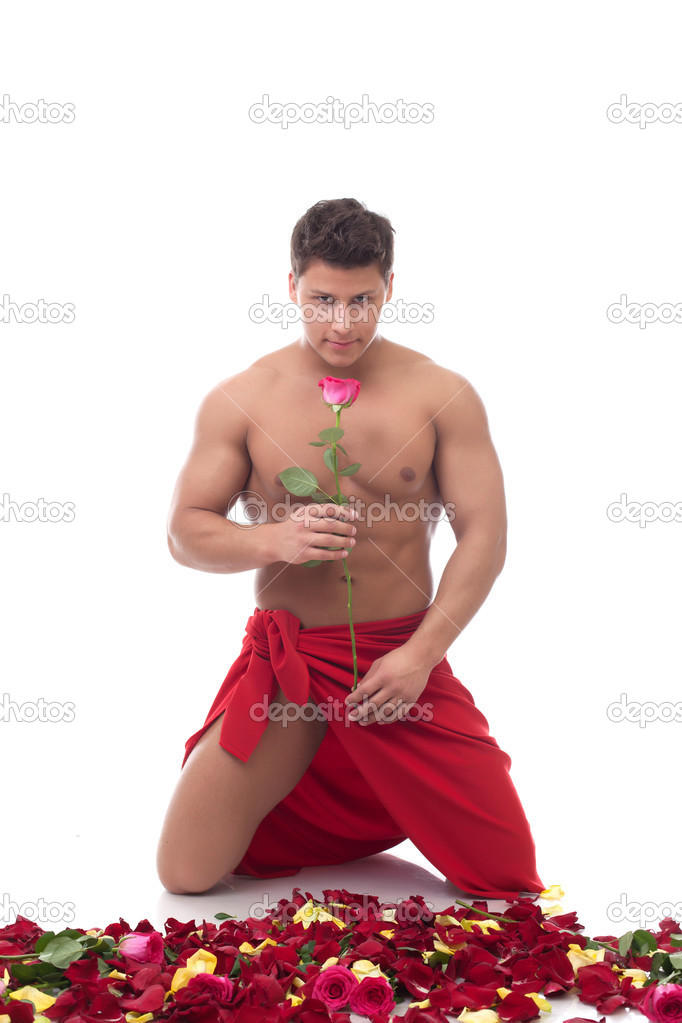 Smiling handsome man with rose posing at camera