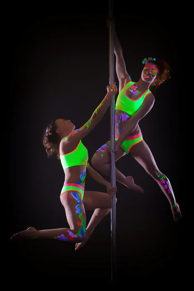 Amazing dancers posing with luminous neon makeup — Stock Photo, Image