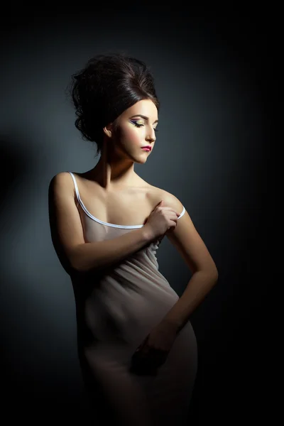 Gorgeous young woman posing in erotic negligee — Stock Photo, Image