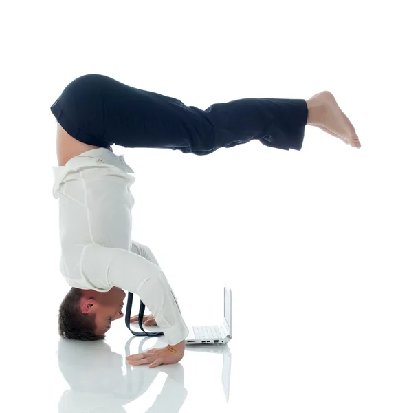 Concept of ​​multitasking - businessman doing yoga — Stock Photo, Image