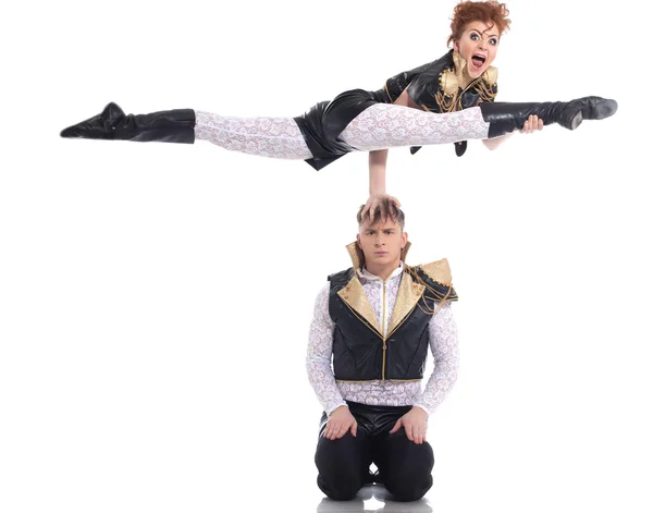 Emotional go-go performers doing acrobatic trick — Stock Photo, Image