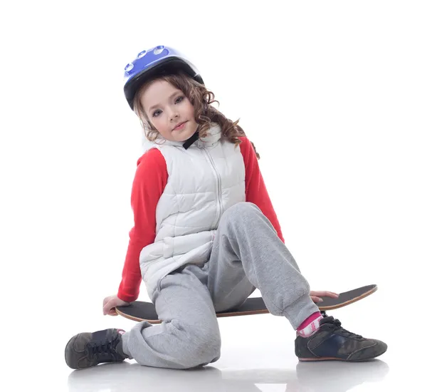 Složené malé skateboardista pózuje na kameru — Stock fotografie