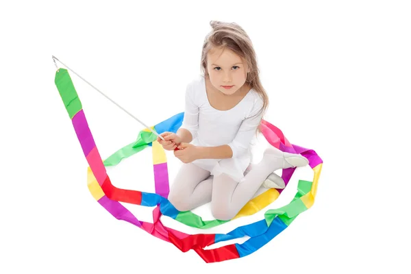 Adorable little girl posing with colorful ribbon — Stock Photo, Image