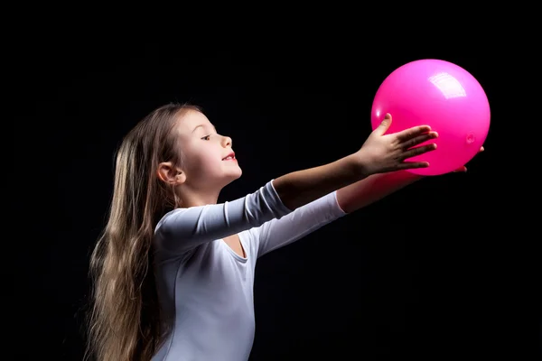 Emotional rhythmic gymnast dancing with ball — Stock Photo, Image