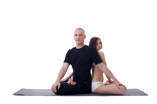 Stilig yoga par poserar i lotusställning — Stockfoto