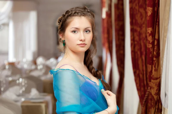 Elegant young girl posing in restaurant — Stock Photo, Image