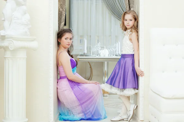 Enchanting young models posing in elegant dresses — Stock Photo, Image