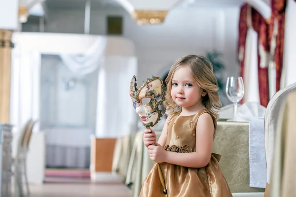 Image of adorable little girl posing with mask — Stock Photo, Image