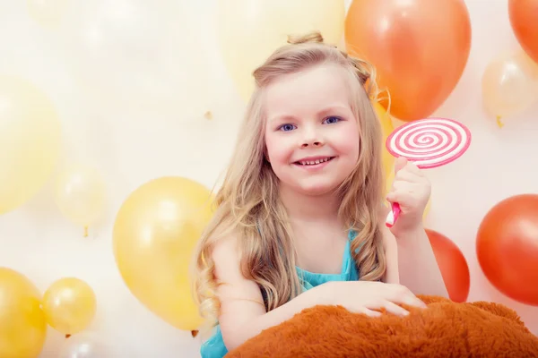 Portrait of funny little model with lollipop — Stock Photo, Image