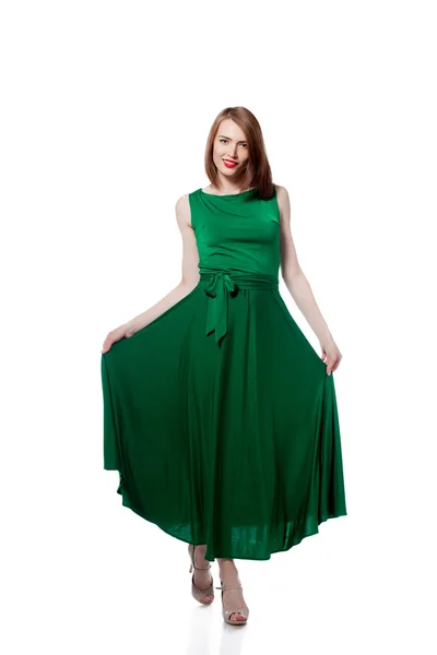 Happy young woman posing in bright green dress — Stock Photo, Image