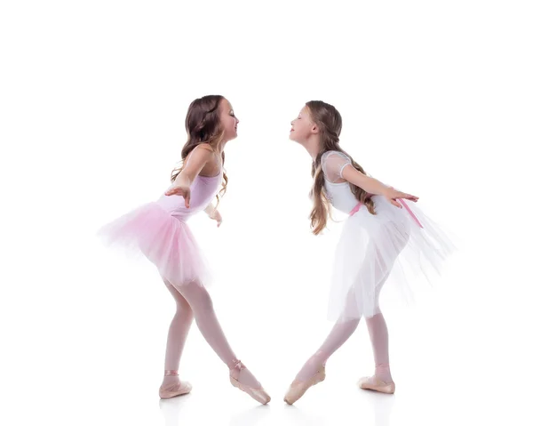 Amusing ballerinas posing looking at each other — Stock Photo, Image