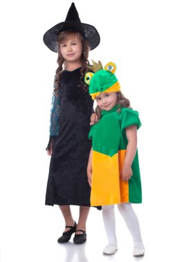 Two smiling sisters posing in carnival costumes clipart