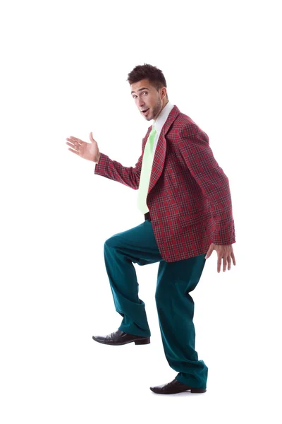 Studio shot of merry man posing in large suit — Stock Photo, Image