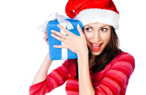 Menina em chapéu de Santa com presentes Imagem De Stock