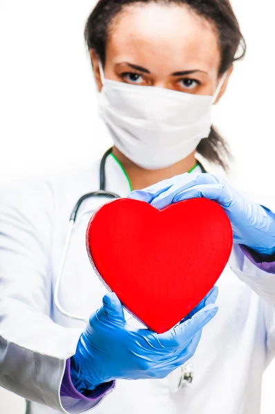 Doctor holding red heart — Stock Photo, Image