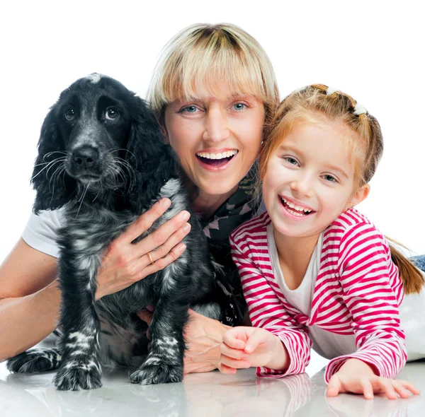 Mother and little girl with dog Stock Image