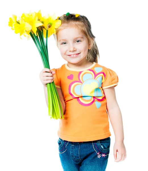 Glad liten flicka med blommor — Stockfoto