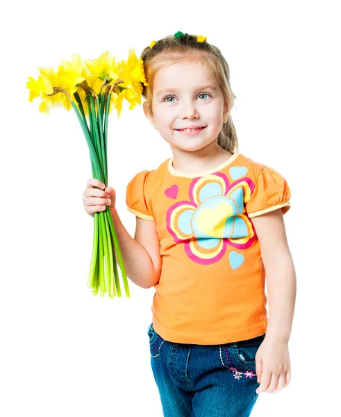 Glad liten flicka med blommor — Stockfoto