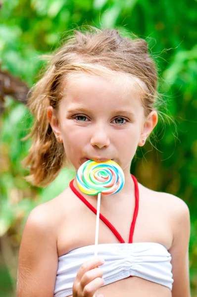 Meisje met snoep — Stockfoto