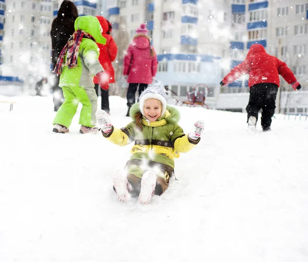 Girl on the ice slide — Stock Photo, Image