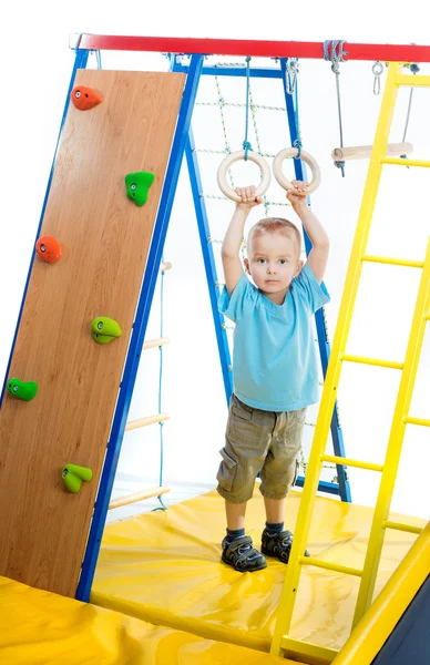 Rapaz num parque infantil — Fotografia de Stock