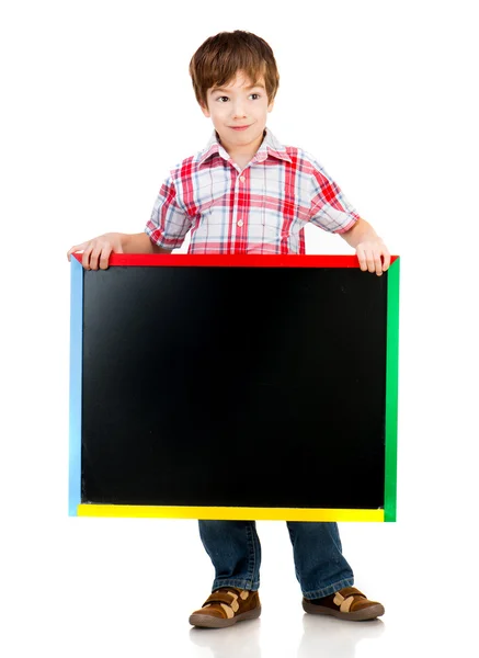 Niño sosteniendo una pizarra — Foto de Stock