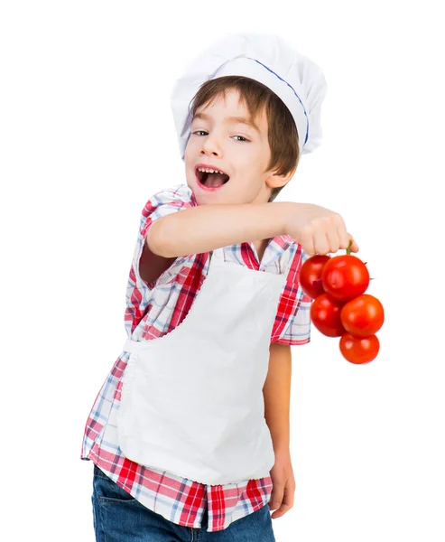 Jongen met tomaten — Stockfoto