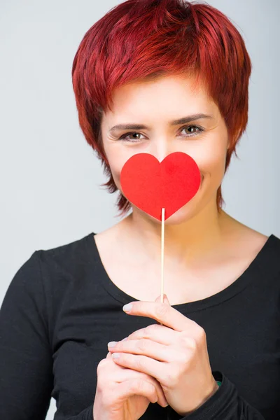 Girl with paper heart Stock Picture