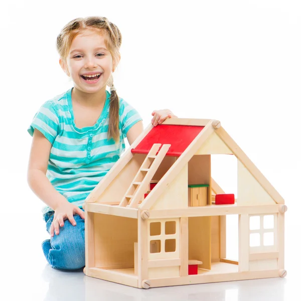 Girl with a toy house — Stock Photo, Image