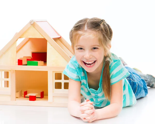 Girl with a toy house — Stock Photo, Image