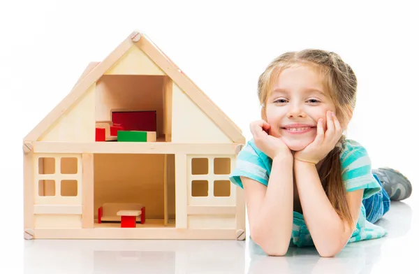 Girl with a toy house — Stock Photo, Image