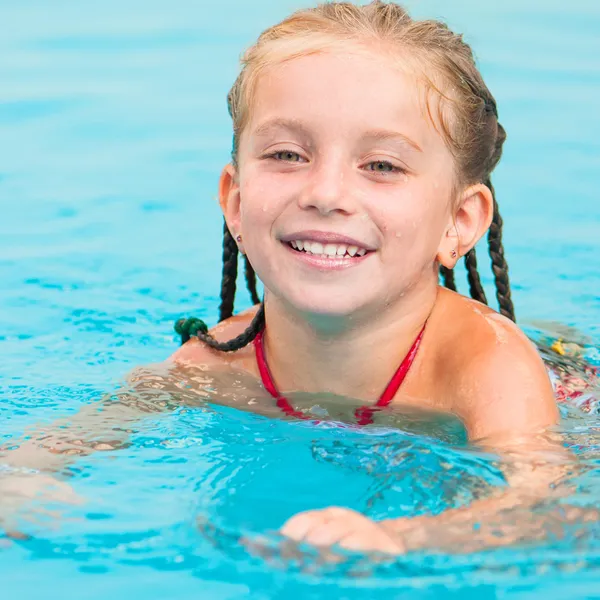 Pretty little girl in swimming... — Stock Photo, Image