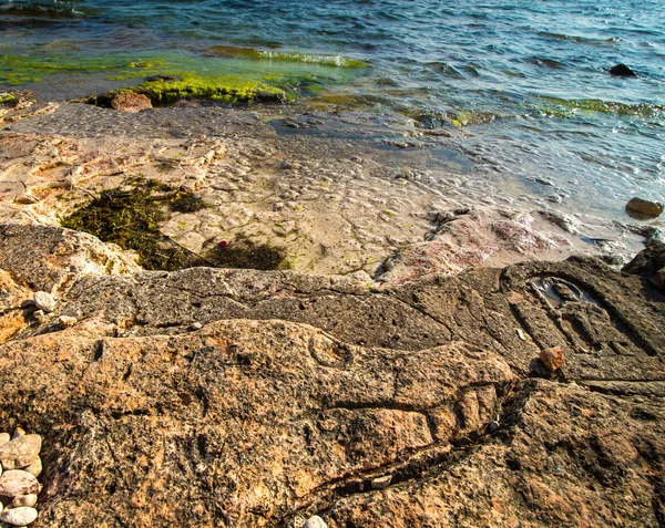 Rock carvings on the beach — Stock Photo, Image