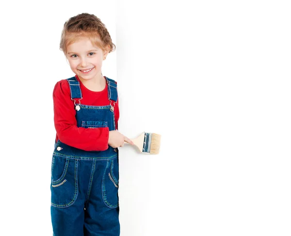 Little girl with a brush and white banner — Stock Photo, Image