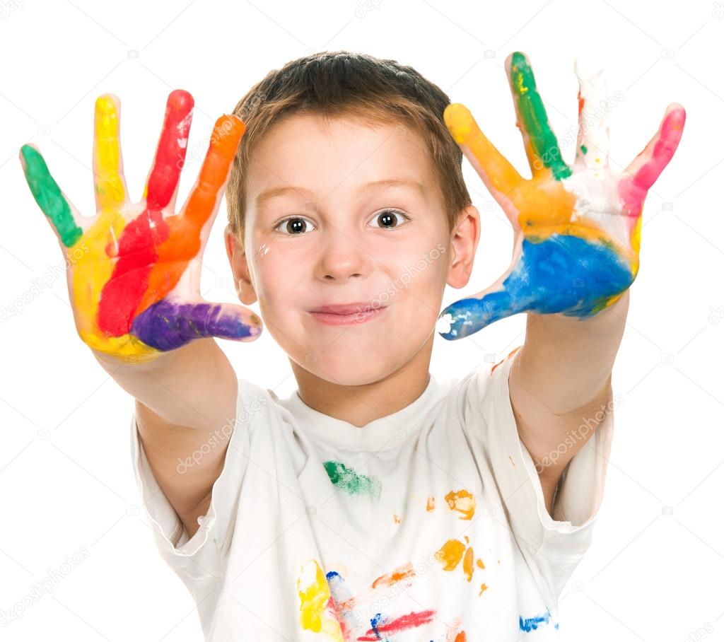 boy shows his hands painted with paint