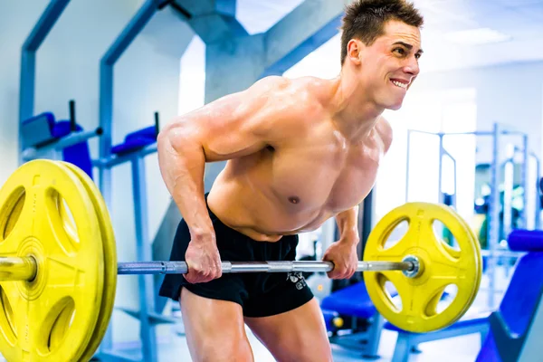 Bodybuilder with barbell — Stock Photo, Image