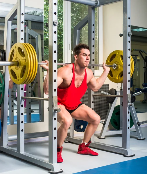 Gewichtheffer squats — Stockfoto