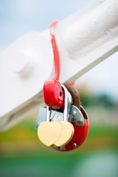 Romantic padlock in heart shape on the bridge — Stock Photo, Image