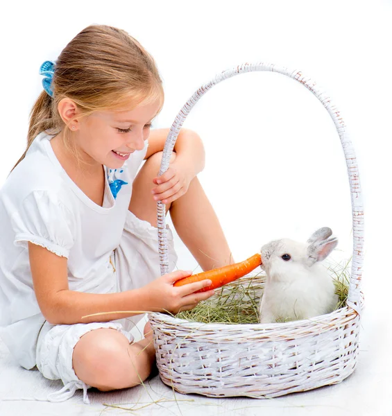 Little girl with a rabbit — Stok fotoğraf