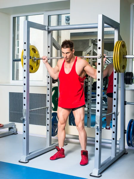 Weightlifter squats — Stock Photo, Image