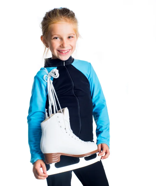 Маленькая девочка с коньками — стоковое фото