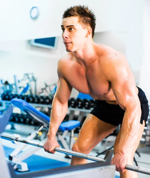 Bodybuilder with barbell — Stock Photo, Image