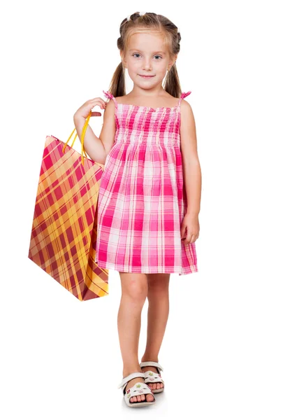 Cute little girl with shopping bag — Stock Photo, Image