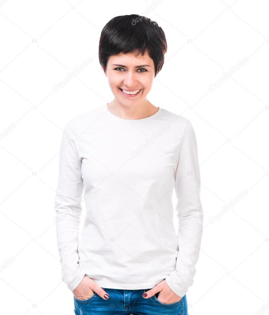 Smiling brunette woman in white blouse and jeans